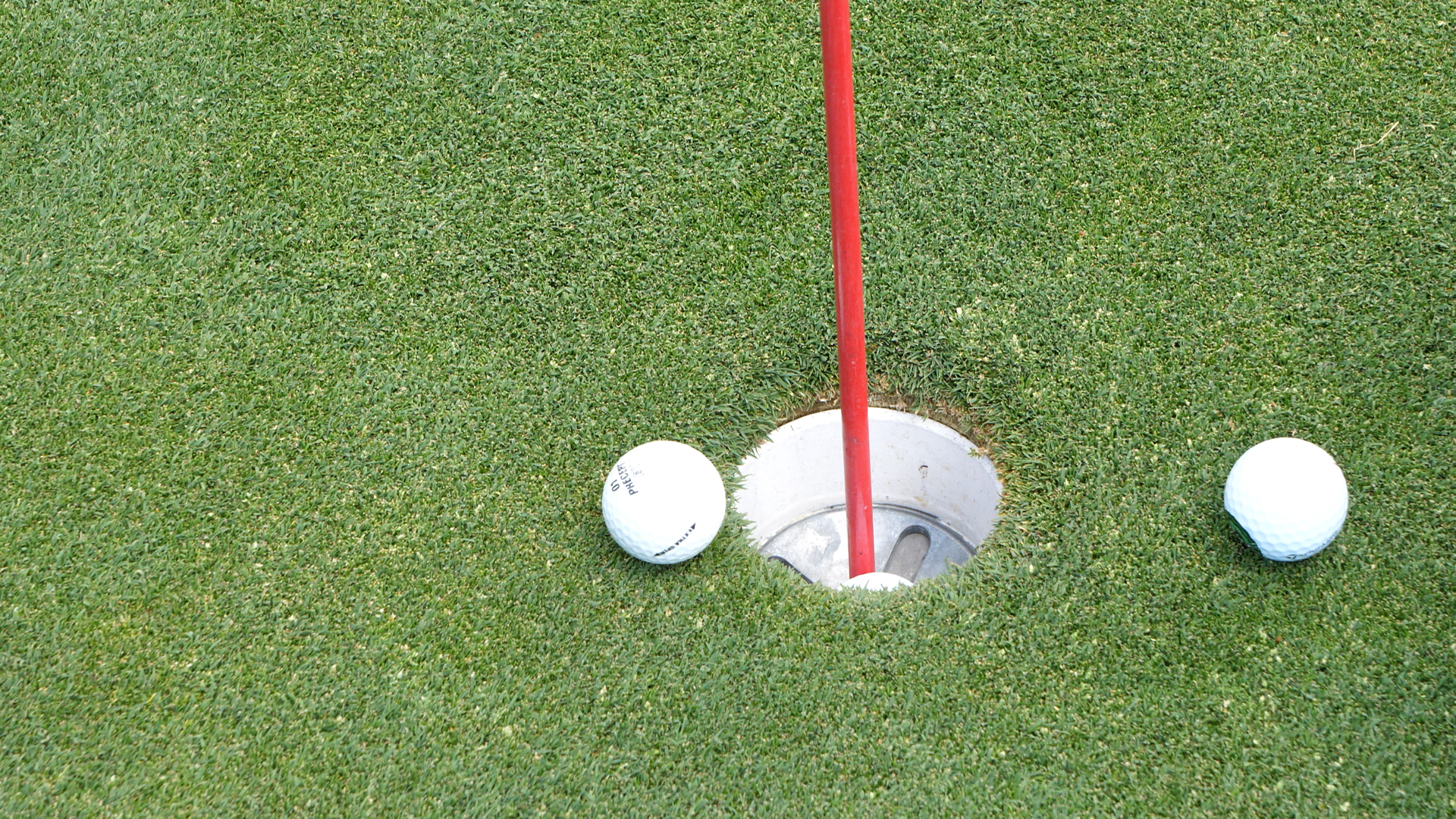  golf balls and hole